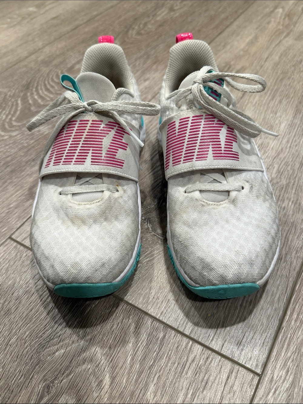 Nike Women’s White Athletic Sneakers with Pink Logo and Teal Accents